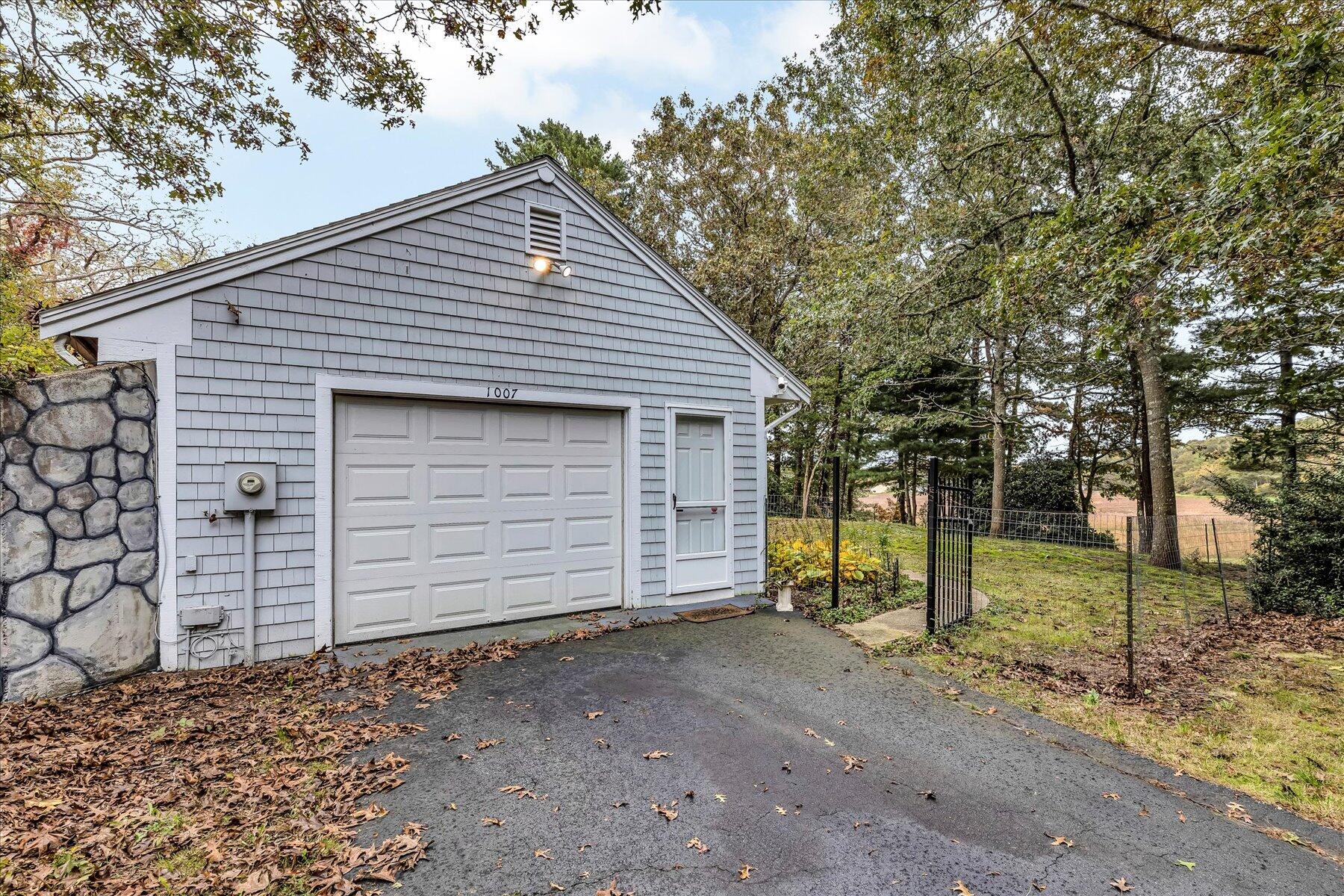 1007 River Road Marstons Mills, MA 02648 - Photo 3 of 33 a view of a house with a backyard