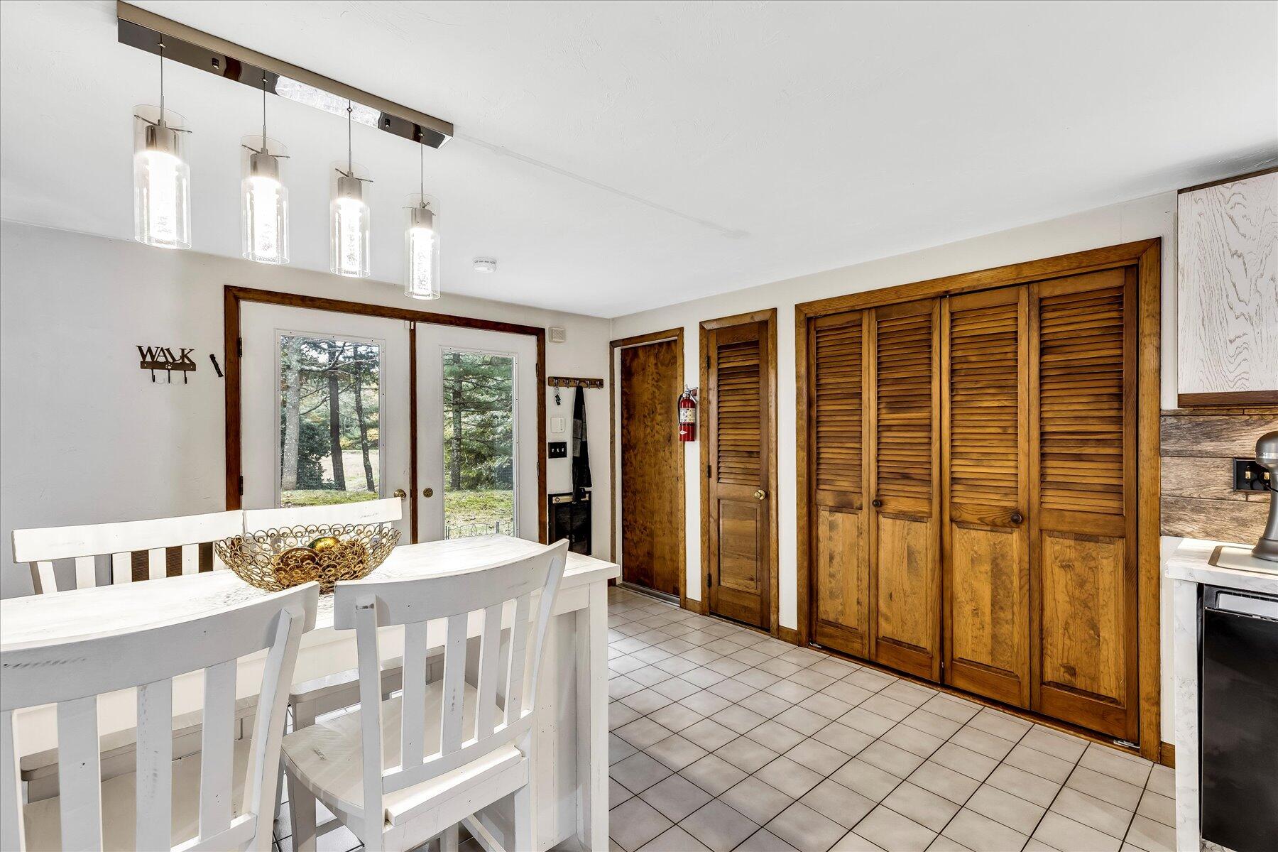1007 River Road Marstons Mills, MA 02648 - Photo 10 of 33 a bedroom with furniture and large window