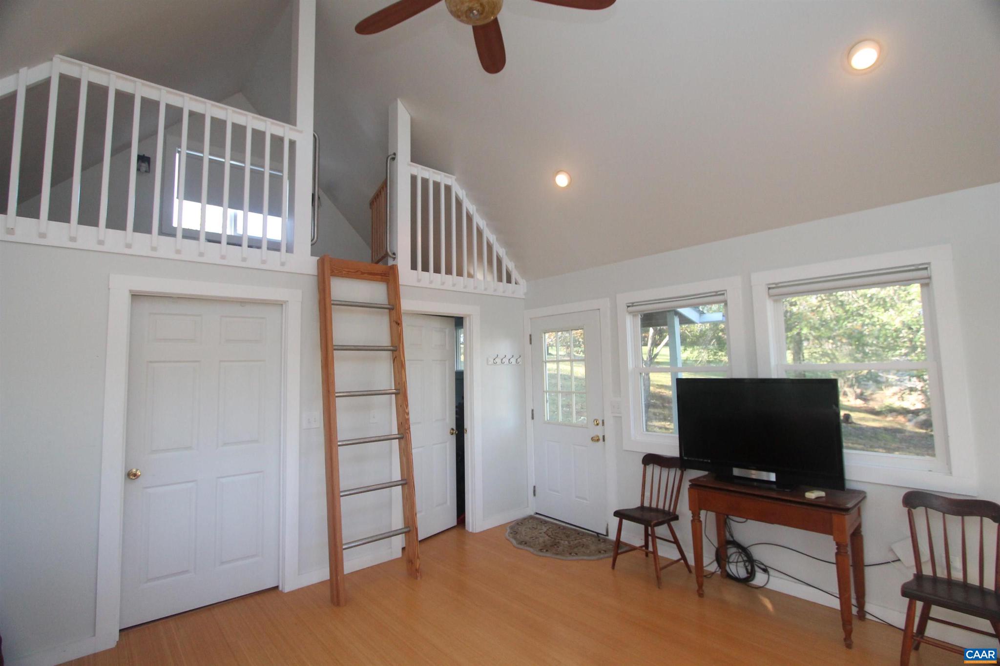 Tbd Batesville Road, Unit 2 Afton, VA 22920 - Photo 15 of 28 a living room with furniture and a flat screen tv
