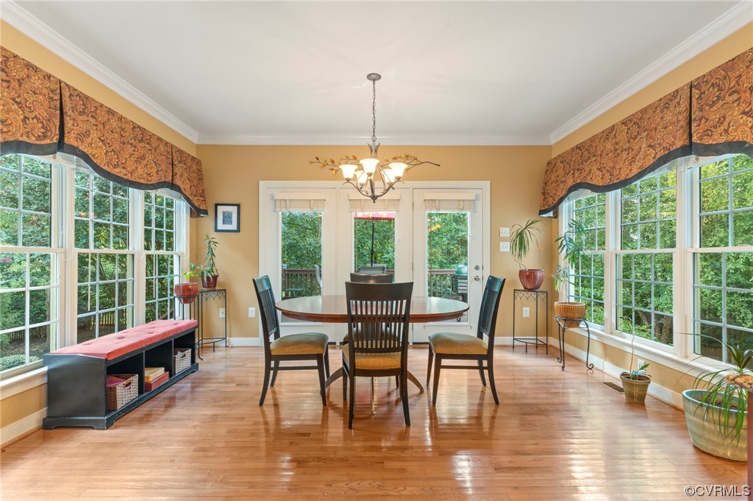 13206 Tipple Point Road Midlothian, VA 23114 - Photo 11 of 50 a view of a dining room with furniture window and wooden floor
