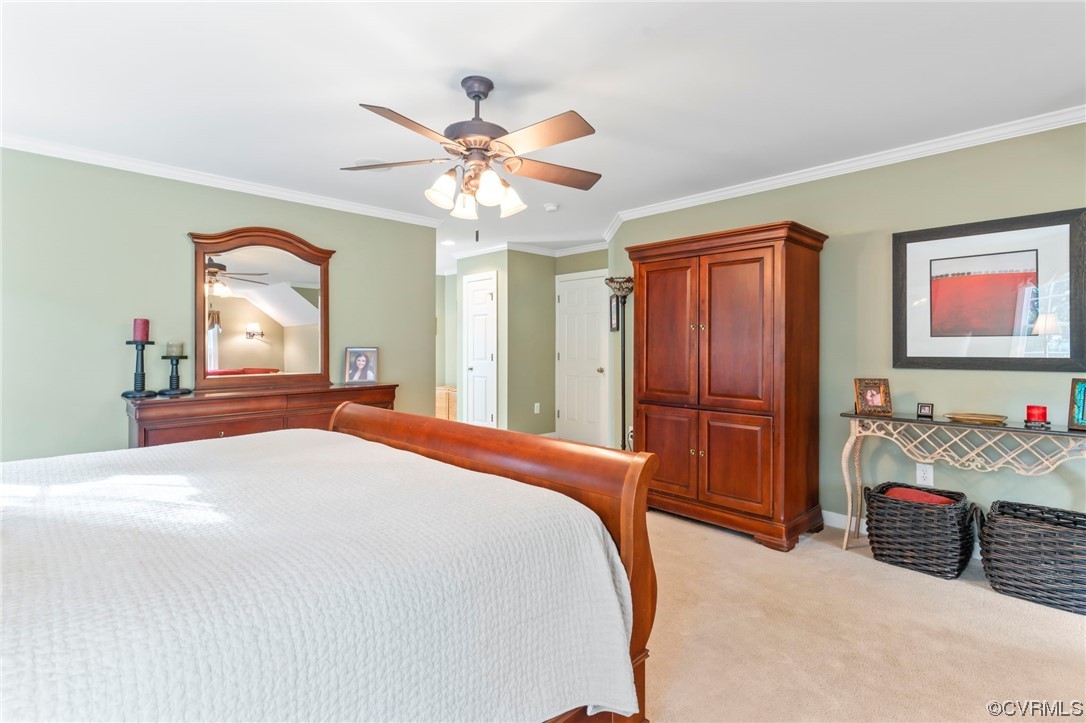 13206 Tipple Point Road Midlothian, VA 23114 - Photo 19 of 50 a bedroom with a bed and a chandelier