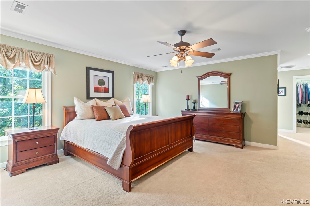 13206 Tipple Point Road Midlothian, VA 23114 - Photo 20 of 50 a bedroom with a bed and a chandelier
