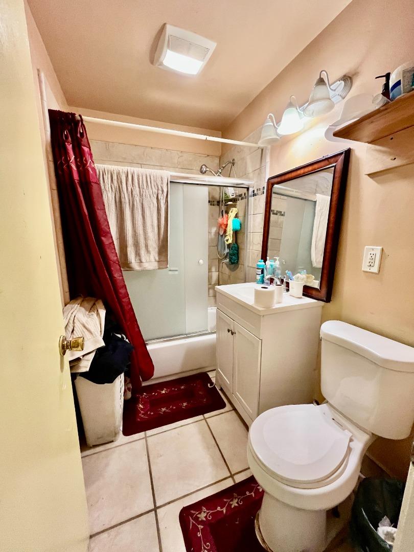 128 Maple Avenue Watsonville, CA 95076 - Photo 20 of 29 a bathroom with a toilet sink and mirror