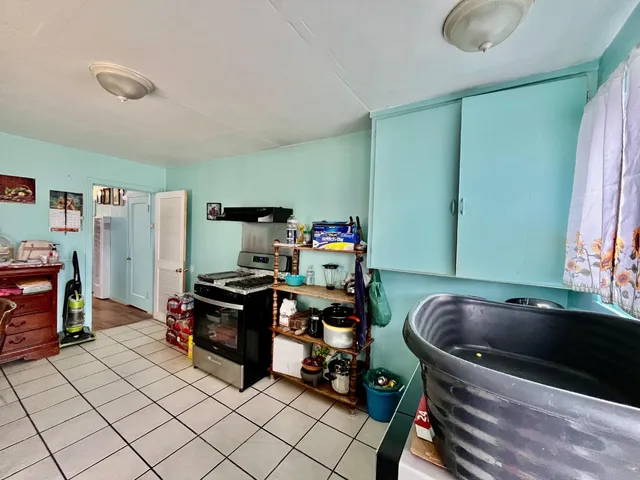 a bed room with furniture and a window