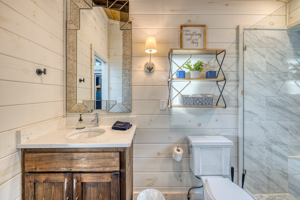 190 Firefly Road Blue Ridge, GA 30513 - Photo 25 of 70 a bathroom with a sink and a mirror