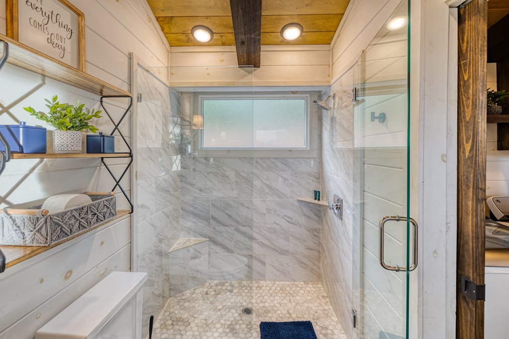 190 Firefly Road Blue Ridge, GA 30513 - Photo 28 of 70 a bathroom with a granite countertop sink a mirror and shower
