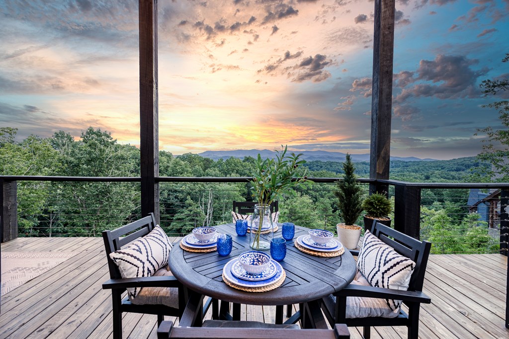 190 Firefly Road Blue Ridge, GA 30513 - Photo 39 of 70 a view of a patio with a table chairs and a table