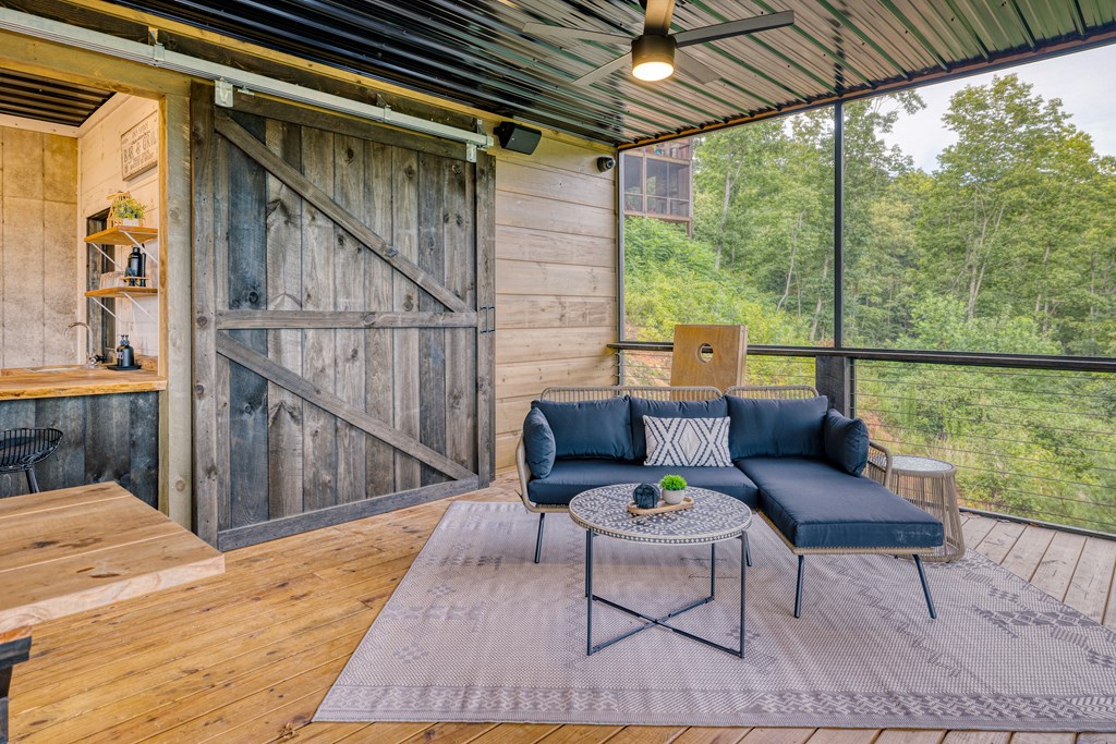 190 Firefly Road Blue Ridge, GA 30513 - Photo 56 of 70 a outdoor living space with furniture and wooden floor