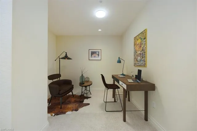 a view of a workspace with furniture