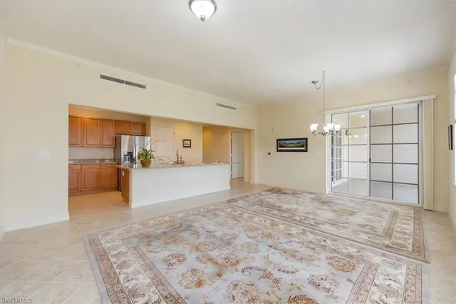 a view of a big room with closet and windows