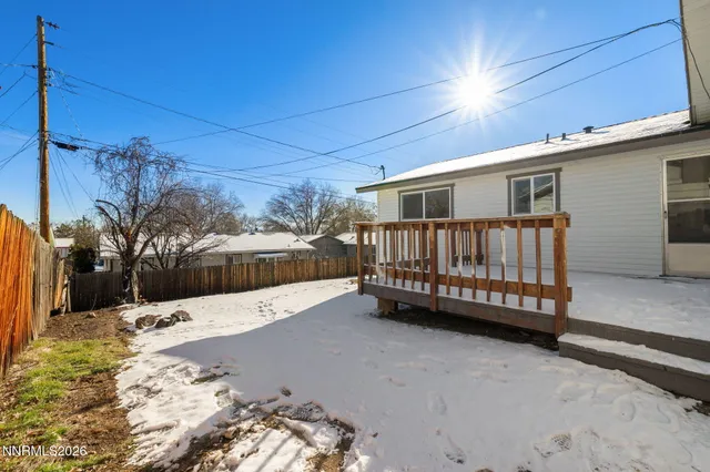 a view of a house with a yard and pathway