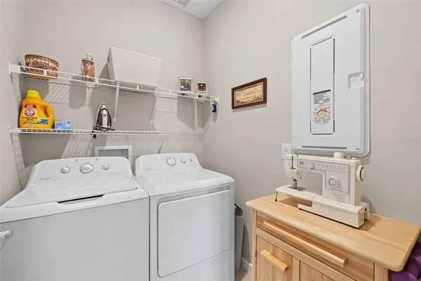a utility room with dryer and washer