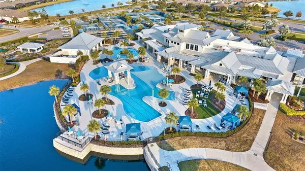 an aerial view of a house with a swimming pool