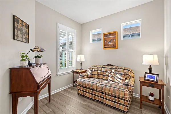 a bedroom with a bed and a chair