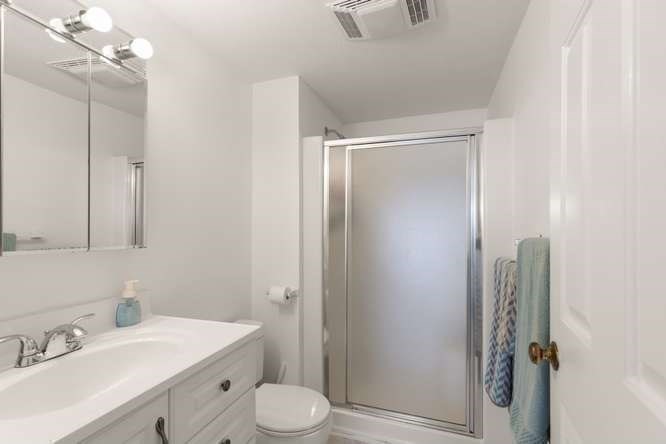 198 Locust Street, Unit 1702 Lynn, MA 01904 - Photo 11 of 26 a bathroom with a sink a toilet and shower