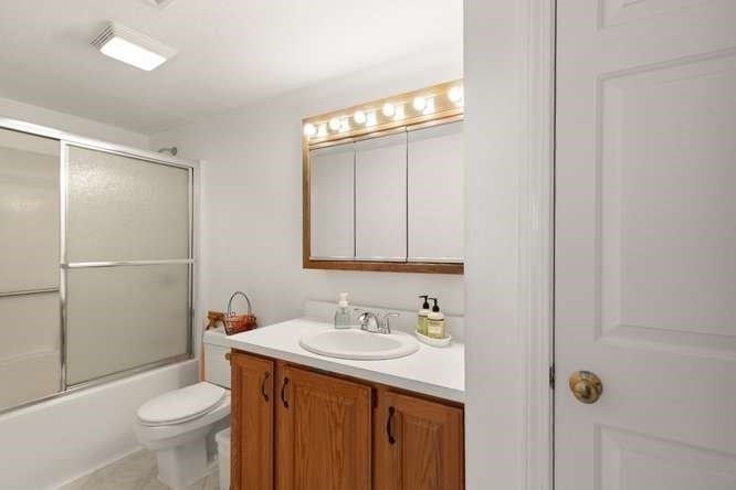 198 Locust Street, Unit 1702 Lynn, MA 01904 - Photo 14 of 26 a bathroom with a sink toilet and shower