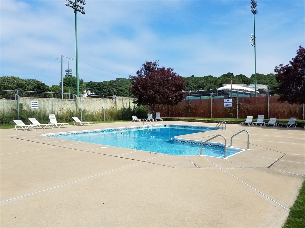 198 Locust Street, Unit 1702 Lynn, MA 01904 - Photo 21 of 26 a view of a swimming pool with a yard
