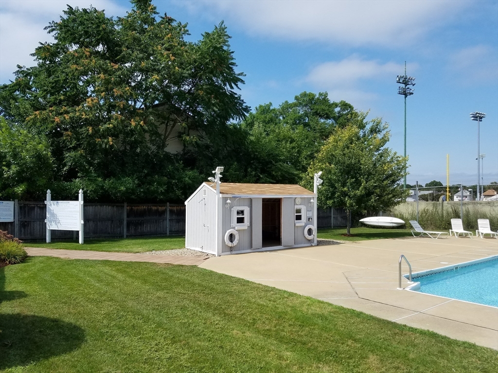 198 Locust Street, Unit 1702 Lynn, MA 01904 - Photo 23 of 26 a view of a house with backyard and trees