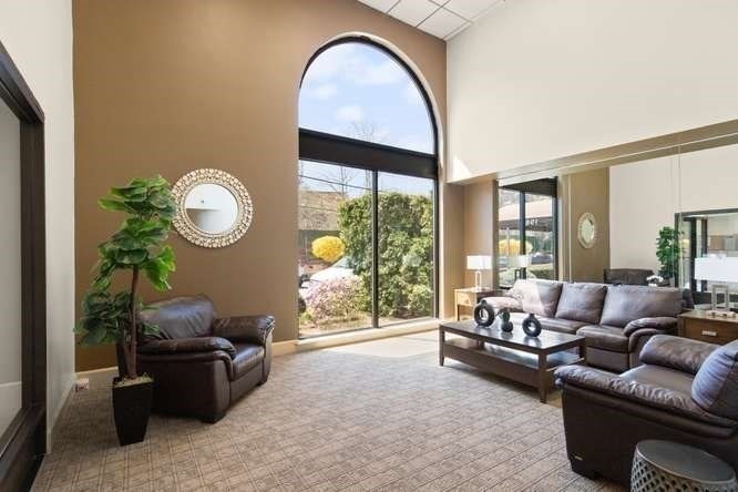 198 Locust Street, Unit 1702 Lynn, MA 01904 - Photo 4 of 26 a living room with furniture and a large window