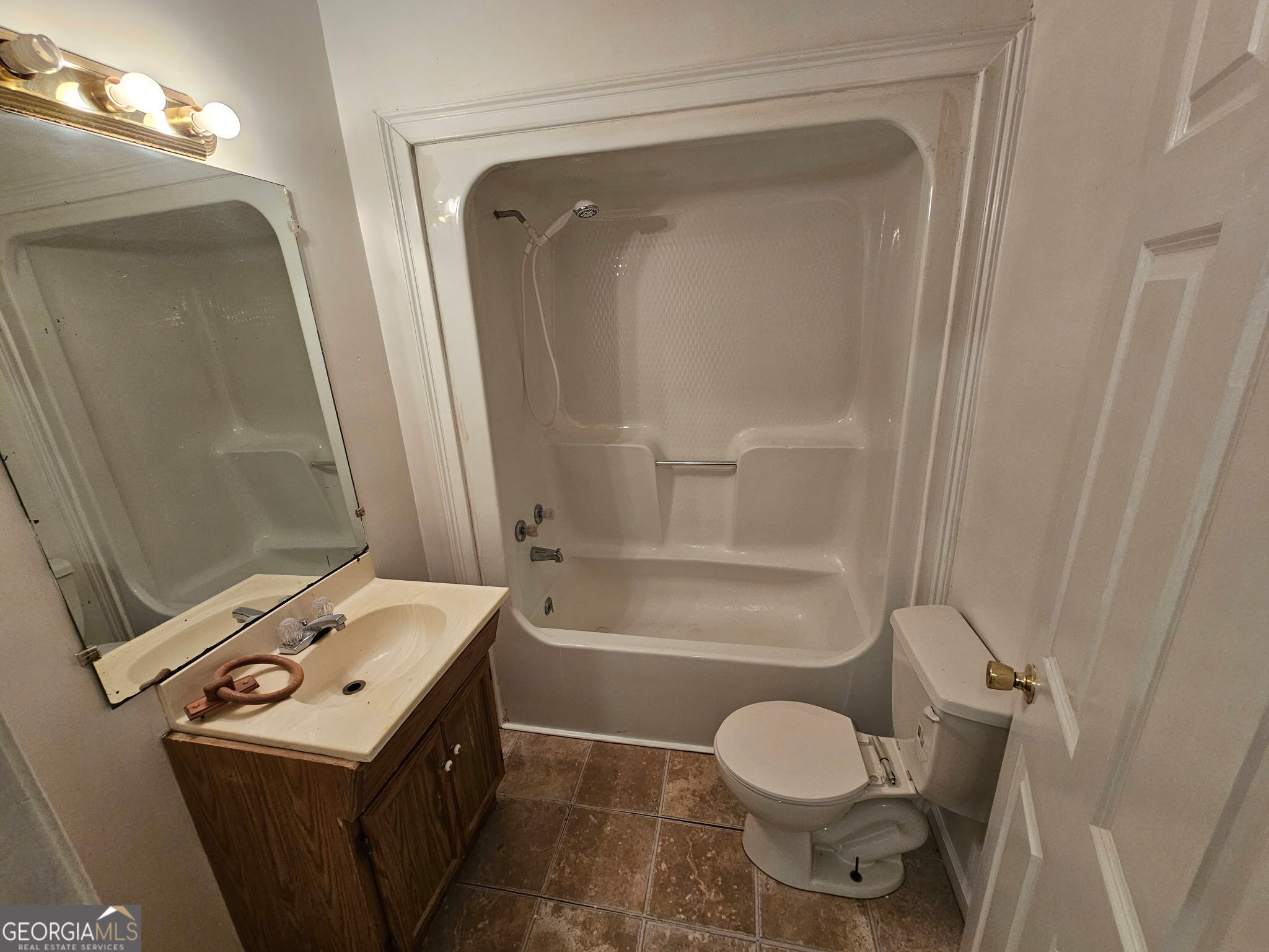 410 Atlantic Avenue Bremen, GA 30110 - Photo 6 of 10 a bathroom with a sink toilet and shower