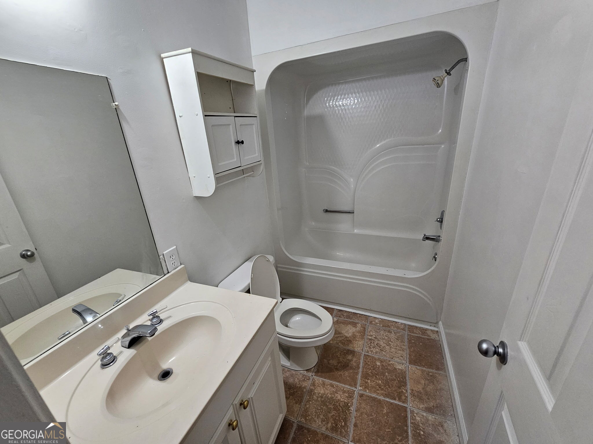 410 Atlantic Avenue Bremen, GA 30110 - Photo 7 of 10 a bathroom with a sink a toilet and shower