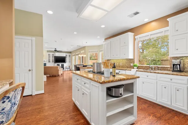 a open kitchen with a table and chairs in it