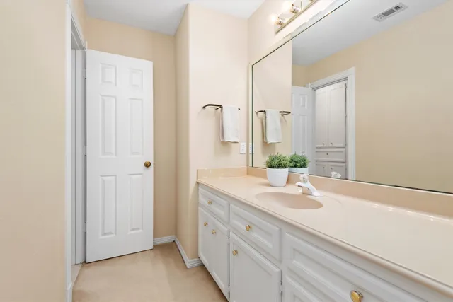 a bathroom with a double vanity sink and mirror