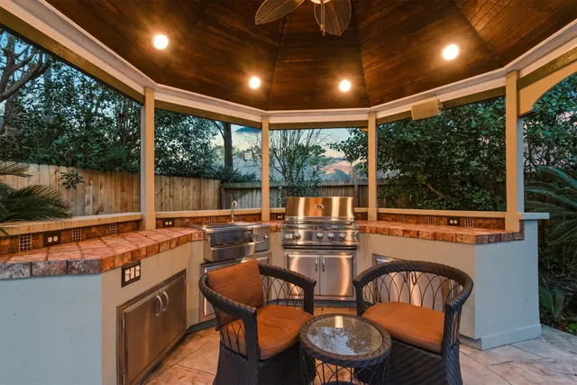 a outdoor dining space with furniture and outdoor view