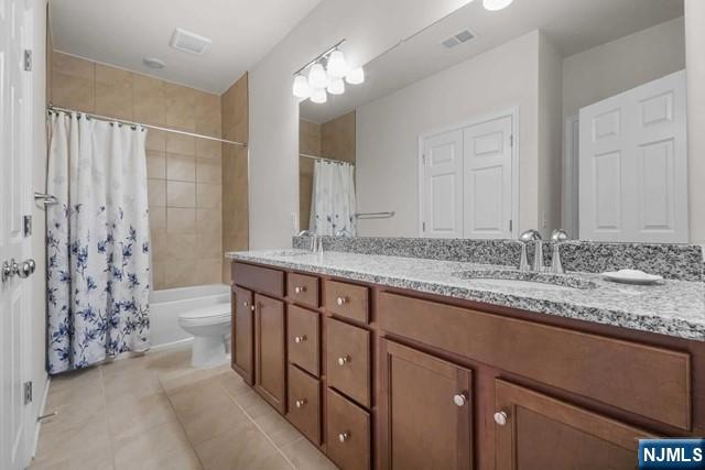 54 Arnold Drive Wood-Ridge, NJ 07075 - Photo 26 of 40 a bathroom with a granite countertop double vanity sink a mirror and a shower