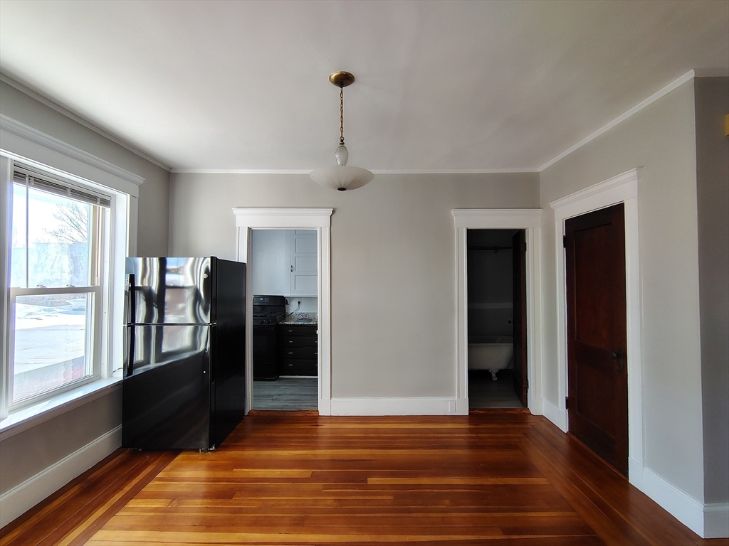 1 Harbor Street, Unit 3 Salem, MA 01970 - Photo 6 of 10 a view of a room with wooden floor and windows