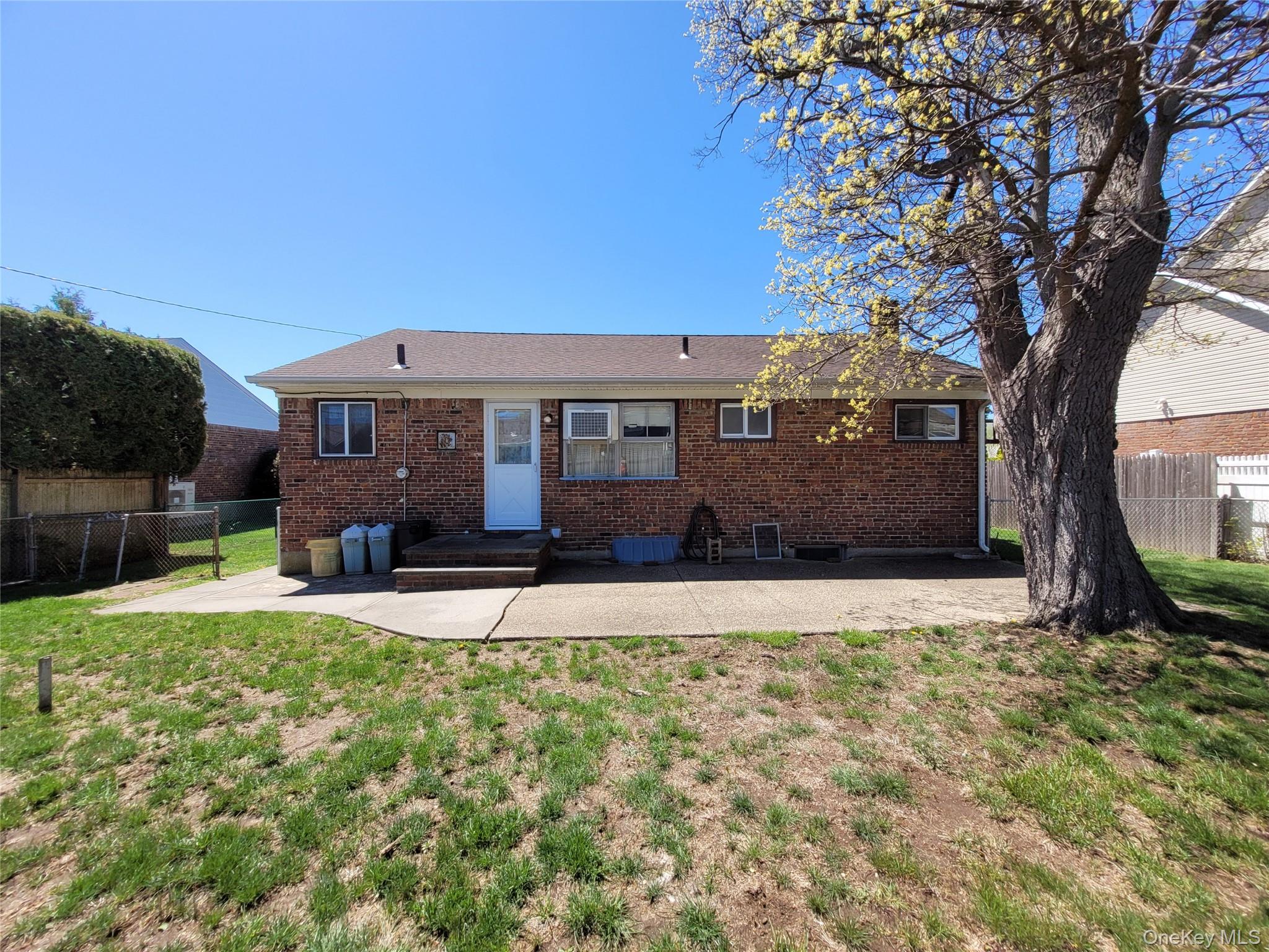 12 Clark Street Plainview, NY 11803 - Photo 4 of 14 a house view with a garden space