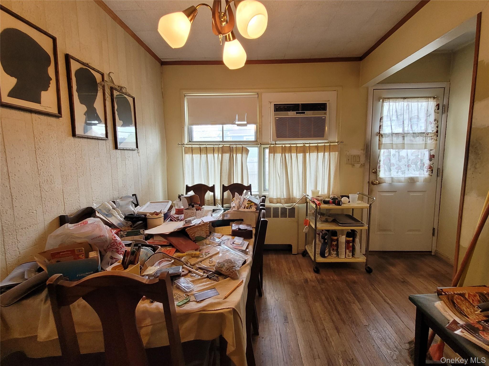 12 Clark Street Plainview, NY 11803 - Photo 6 of 14 a view of a dining room with furniture window and wooden floor