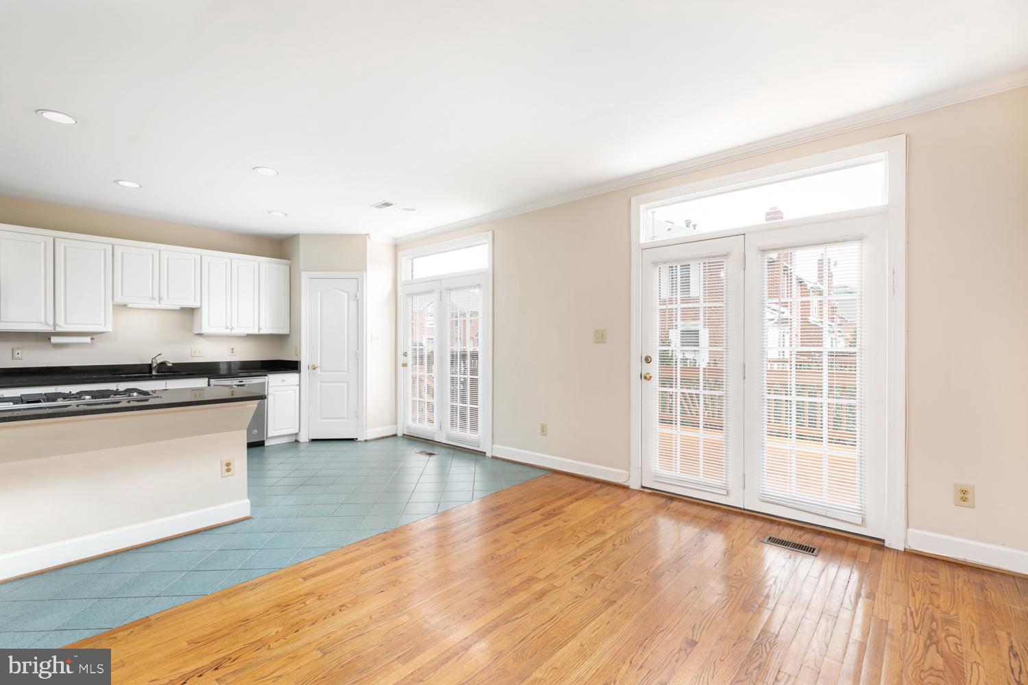 8165 Madrillon Court Vienna, VA 22182 - Photo 12 of 33 a view of a kitchen with wooden floor and a window