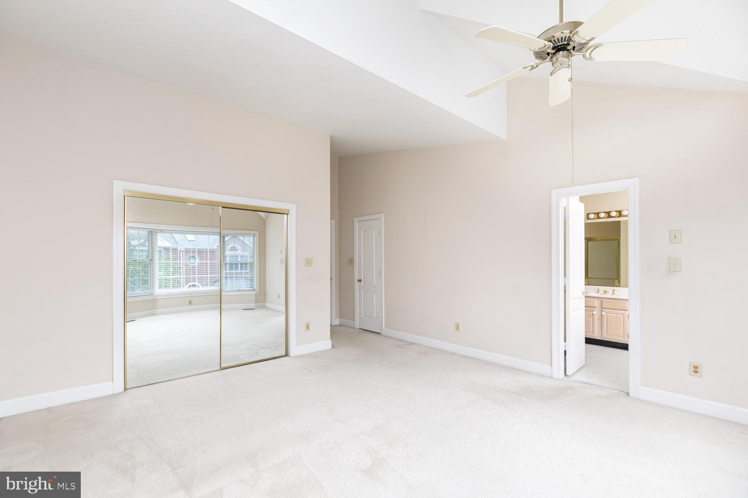 8165 Madrillon Court Vienna, VA 22182 - Photo 17 of 33 an empty room with chandelier fan