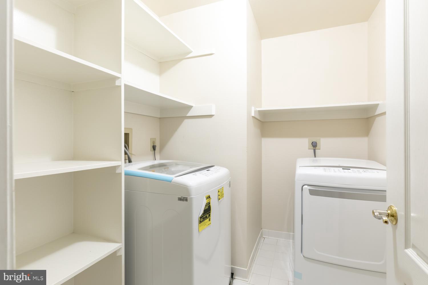 8165 Madrillon Court Vienna, VA 22182 - Photo 24 of 33 a utility room with dryer and washer