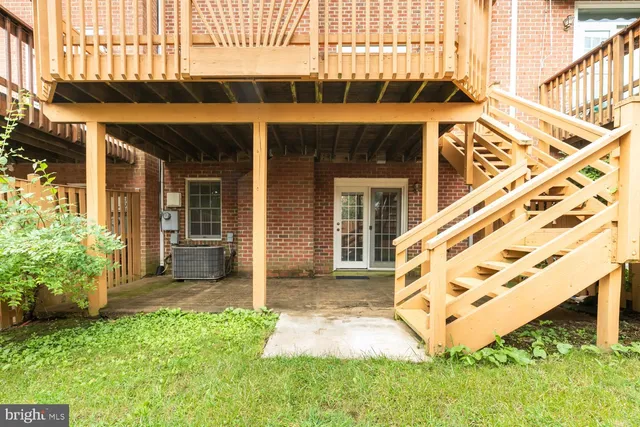 a view of a house with a wooden fence