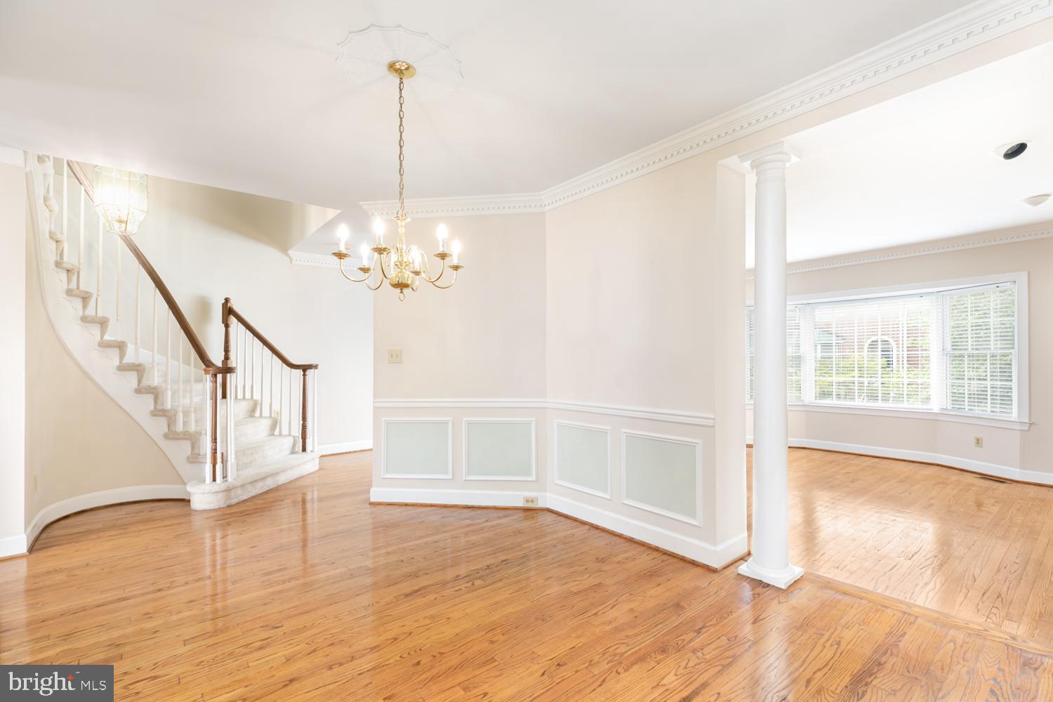 8165 Madrillon Court Vienna, VA 22182 - Photo 7 of 33 a view of an empty room with wooden floor and a window