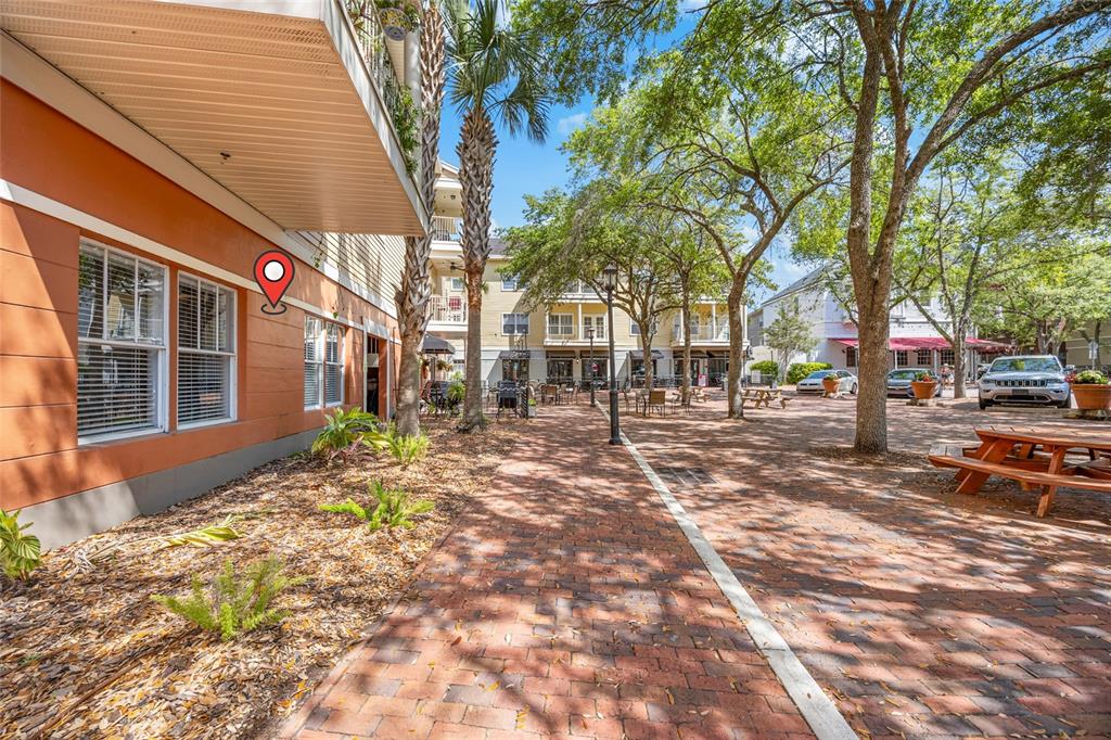 5141 Southwest 91st Way, Unit I102 Gainesville, FL 32608 - Photo 18 of 25 a view of road with large trees