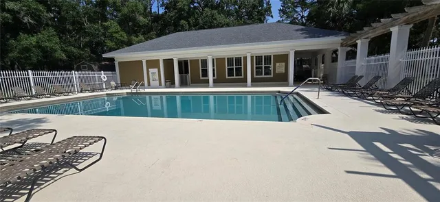 a view of a house with pool table and chairs