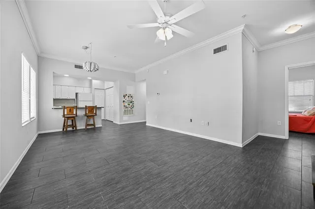 a view of a livingroom with a piano and wooden floor