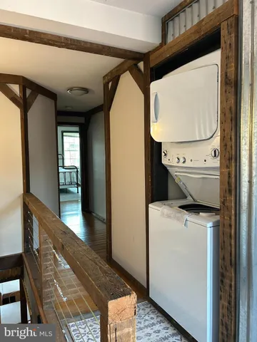 a balcony view with a sink and wooden floor