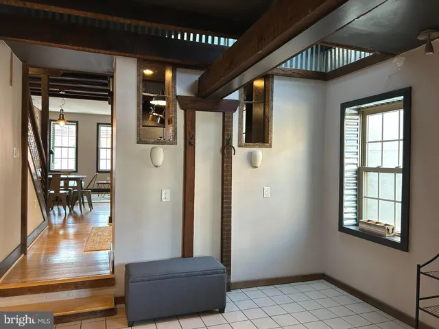 a view of a livingroom with furniture and hardwood floor