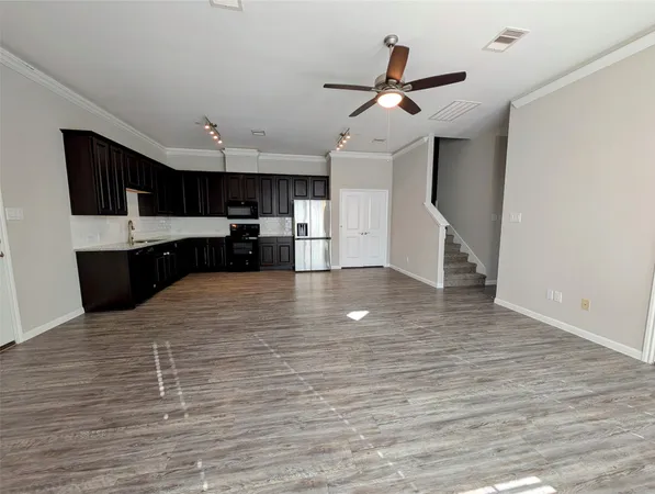 a large kitchen with cabinets