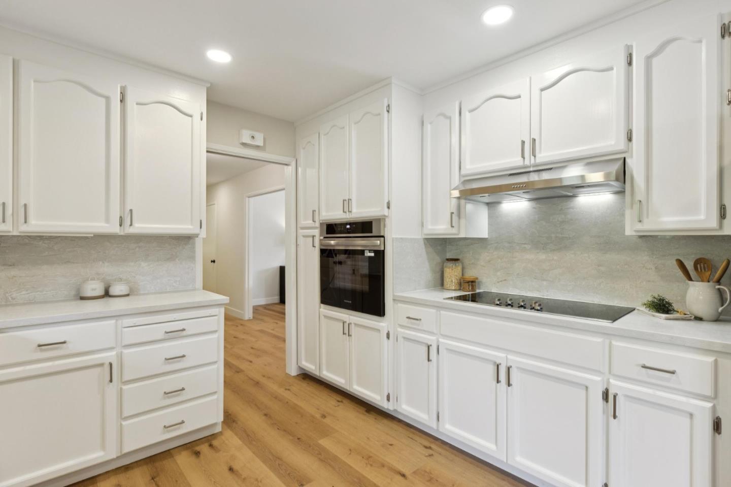 755 Santa Rita Avenue Los Altos, CA 94022 - Photo 17 of 50 a kitchen with white cabinets and refrigerator