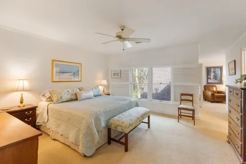 a bedroom with a bed furniture and window