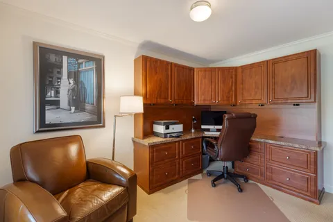 a view of workspace with lounge chair