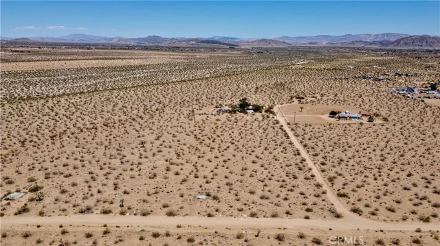 a view of a large body of water with a building in the background