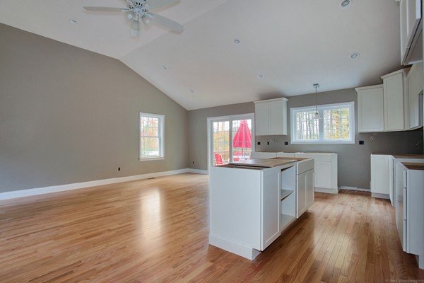 78 Groton Road Shirley, MA 01464 - Photo 11 of 30 a kitchen with granite countertop a stove top oven sink and cabinets