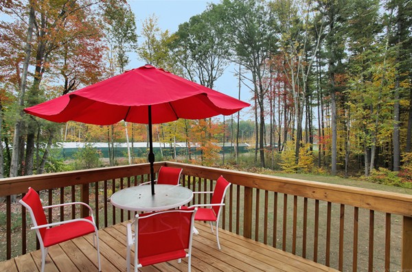 78 Groton Road Shirley, MA 01464 - Photo 25 of 30 a view of deck with furniture and umbrella