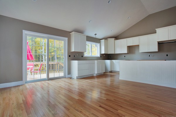 78 Groton Road Shirley, MA 01464 - Photo 7 of 30 a view of a kitchen with wooden floor and electronic appliances